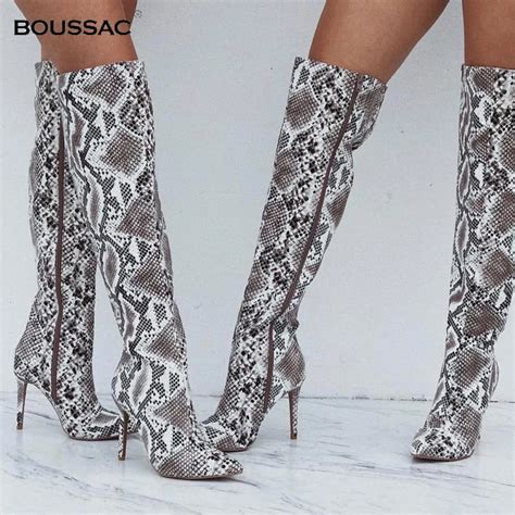 snake print high heel boots.